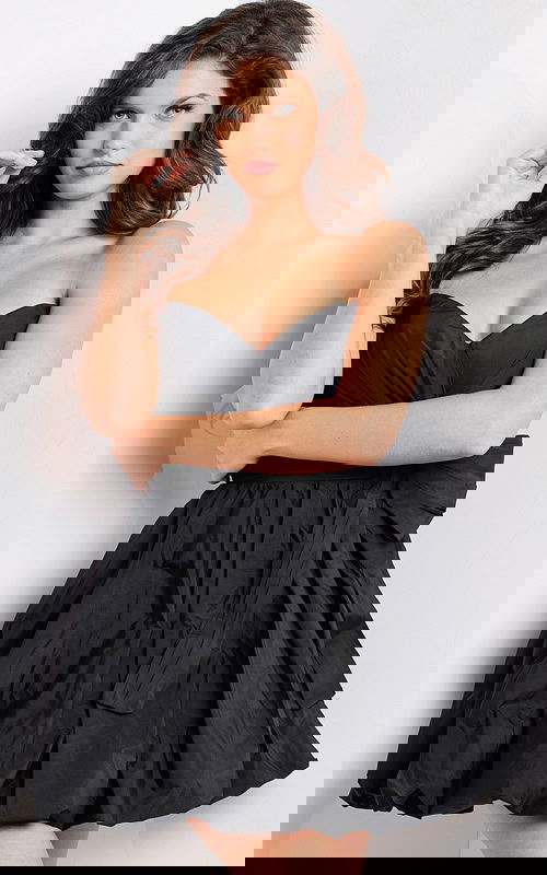 Model wearing Jovani 37016 black dress showcasing sweetheart neckline and fitted bodice.