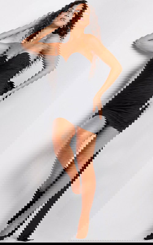 model showcasing Jovani 37026 black mini dress with sweetheart neckline and ruched design