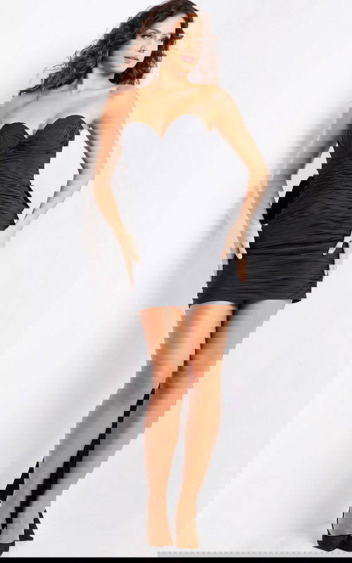 model wearing Jovani 37026 black mini dress with sweetheart neckline and bow detail