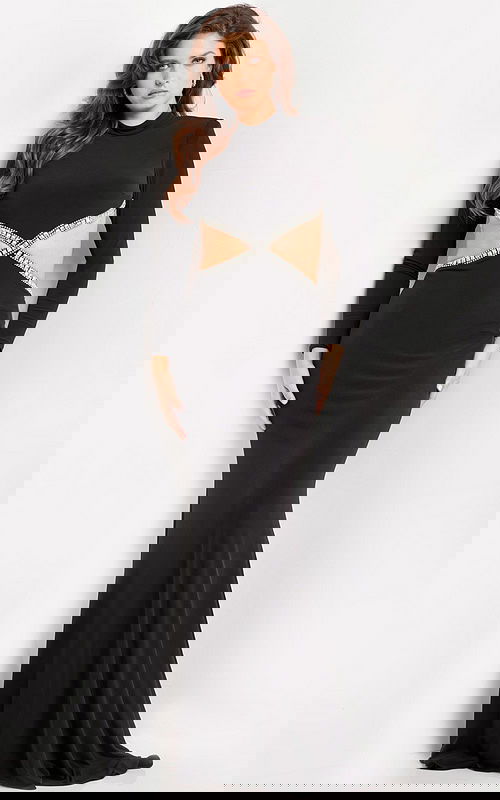 Model wearing Jovani 37037 black gown with side cut-outs, front view.