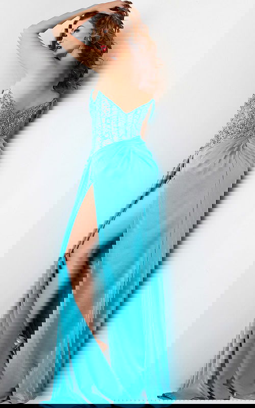 Back view of model in Jovani 37094 blue gown with intricate beadwork