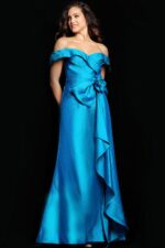 Model wearing Jovani 37098 gown with off-the-shoulder neckline and floral embellishment.
