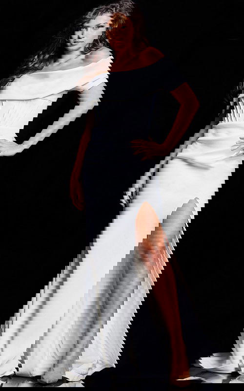 Model wearing Jovani 37148 elegant white gown with off-the-shoulder neckline and high slit from the front.