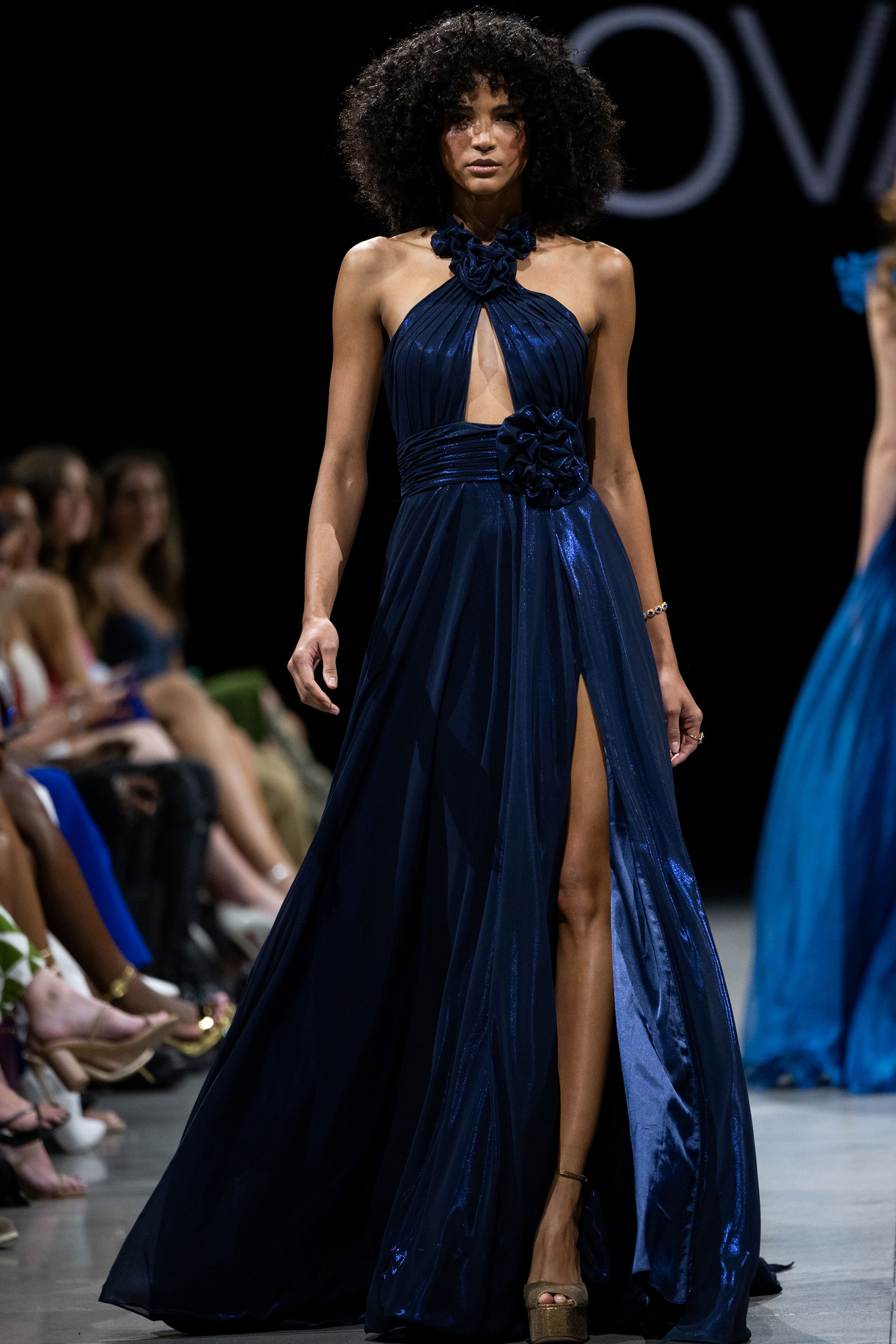 37163.jpg Full front view of Jovani 37163 navy gown with high slit on runway.