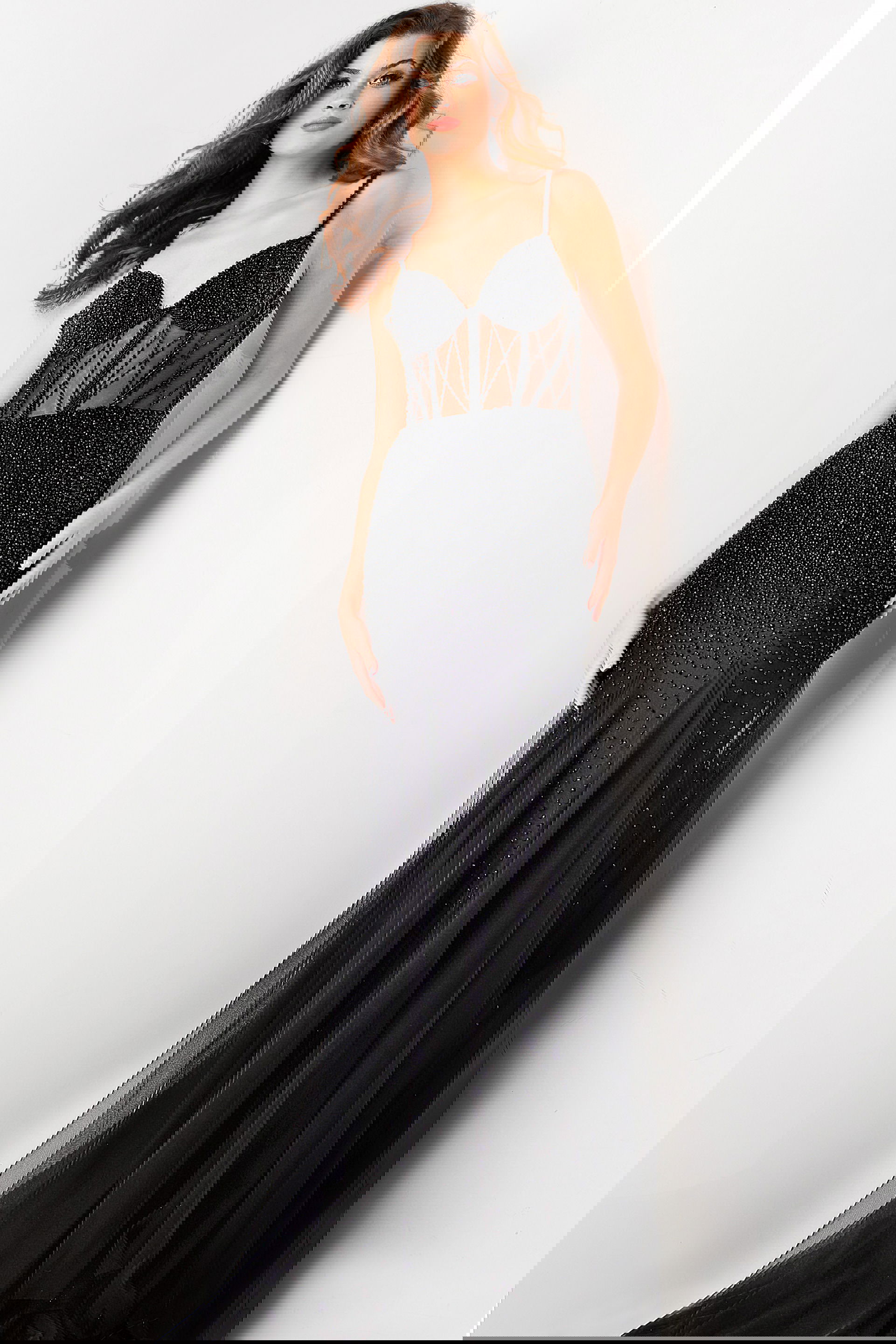 37202-BLACK-6.jpg Model wearing Jovani 37202 black gown with beaded bodice and sweetheart neckline, front view.