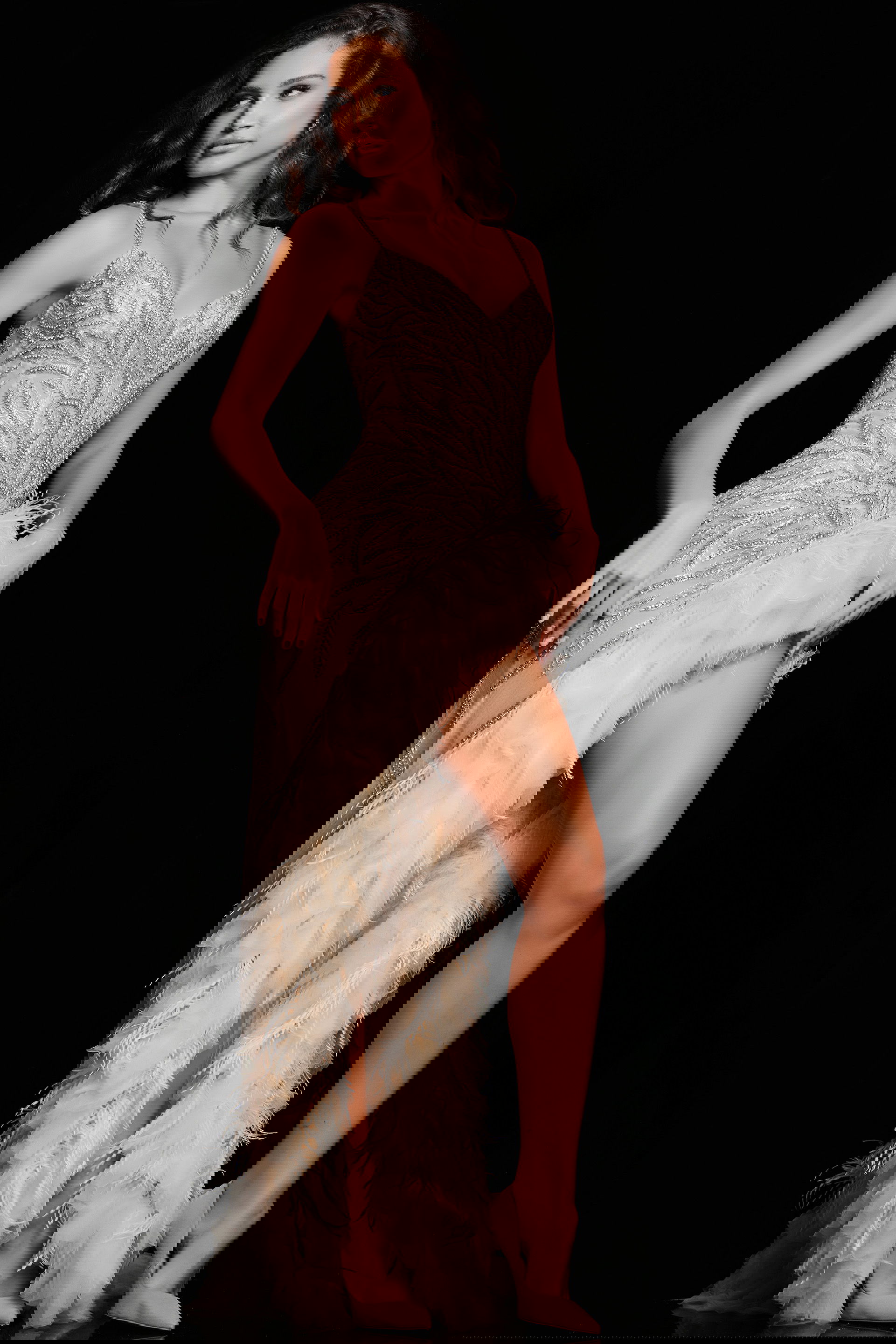 37208_NUDESILVER.jpg Model wearing Jovani 37208 nude evening gown with a sweetheart neckline and feathered skirt.