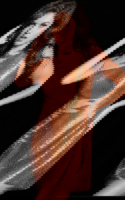 Model wearing Jovani 37242 gold mini dress from front view close-up