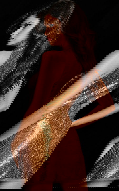 Model wearing Jovani 37242 gold mini dress from back view