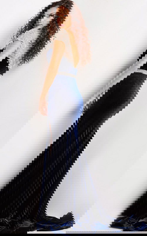 Back view of Jovani 37246 navy gown featuring a low-cut and flowing velvet skirt.