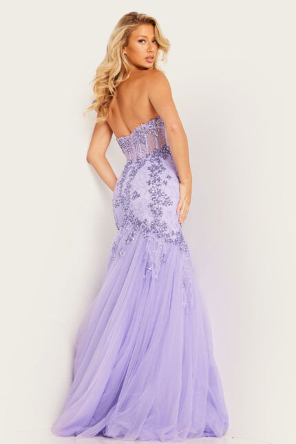 Model showing the back of Jovani 37249 lilac dress, highlighting elegant design.