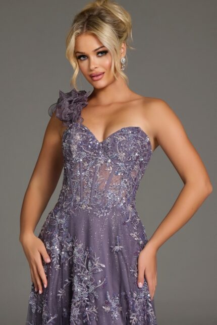 Model wearing Jovani 37353 navy gown, close-up front view focusing on the corset-style bodice and ruffled shoulder strap.