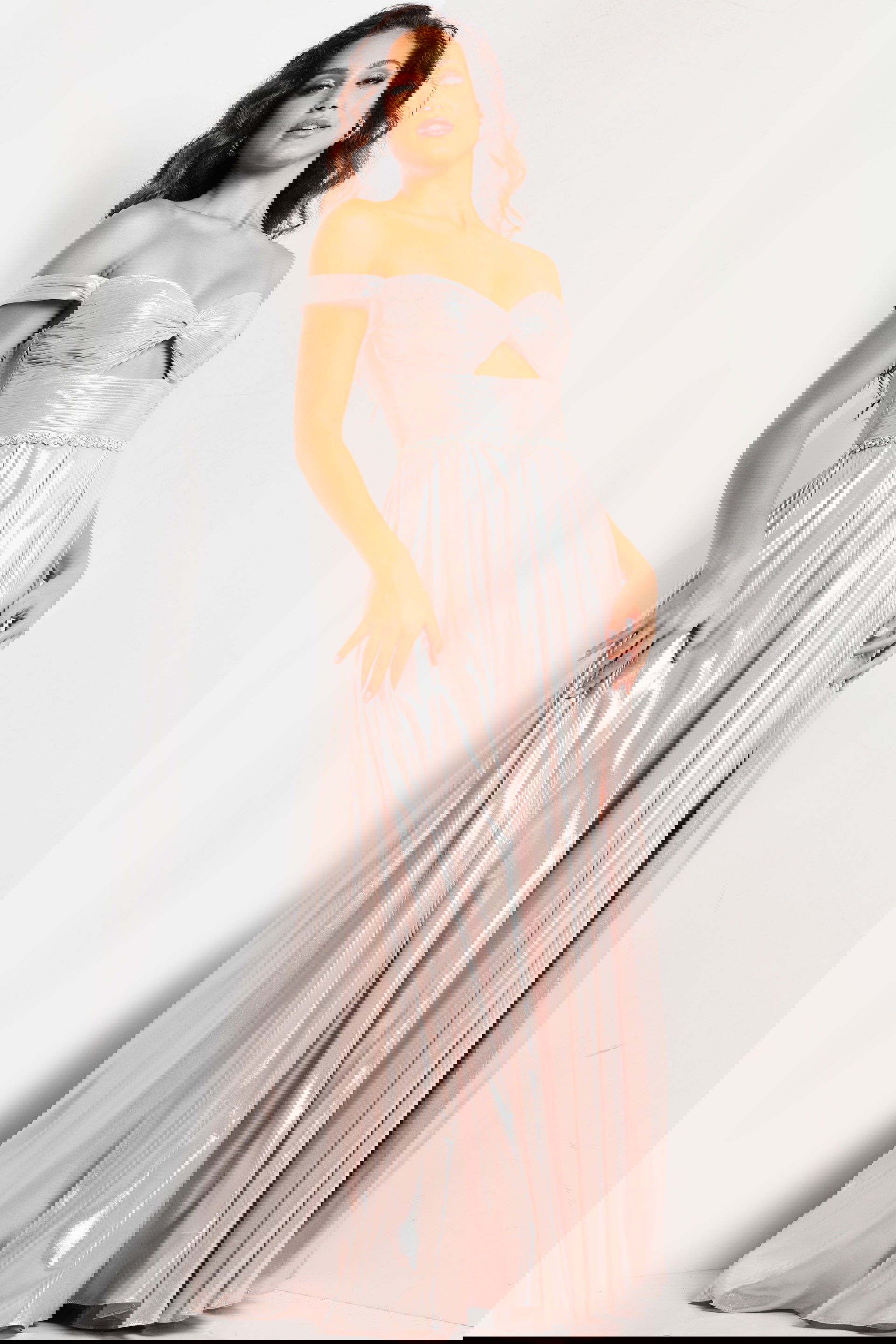 37381_TAUPE_9.jpg Model wearing Jovani 37381 blue gown with off-the-shoulder neckline and A-line silhouette.