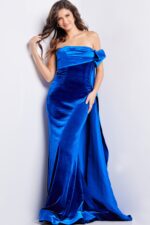 Model wearing Jovani 37390 royal blue gown with off-the-shoulder neckline and cape detail.