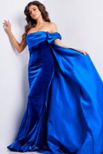 Back view of Jovani 37390 royal blue gown with cape flowing elegantly.