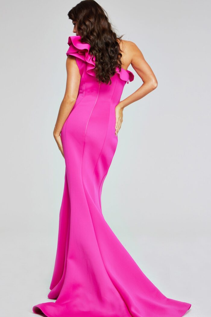 Back angle of model in Jovani 37400 fuchsia gown, highlighting silhouette.