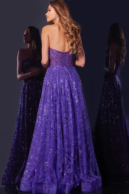 Model wearing Jovani 37413 purple gown, back view showing flowing skirt and details.