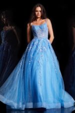 Model wearing Jovani 37421, a royal blue ball gown with scoop neckline and floral embroidery.
