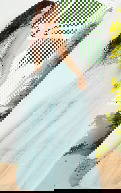 model wearing 37438 light blue gown from the back, showcasing intricate bodice details and full tulle skirt