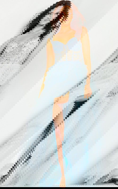 model wearing 37438 light blue gown with intricate embellishments, sweetheart neckline, high slit and ruffled tulle skirt