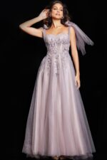 model wearing 37467 elegant blush gown with sweetheart neckline and floral details