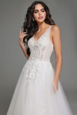 Close-up of model wearing Jovani 37468 white gown with floral embellishments.