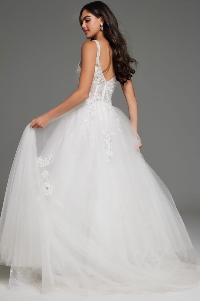 Back view of model in Jovani 37468 white gown showcasing intricate floral detailing.