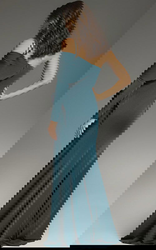 Back view of Jovani 37566 green dress showing the flowing skirt design.