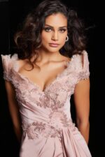 Model wearing Jovani 37572 blush gown close-up, showcasing lace embellishments.