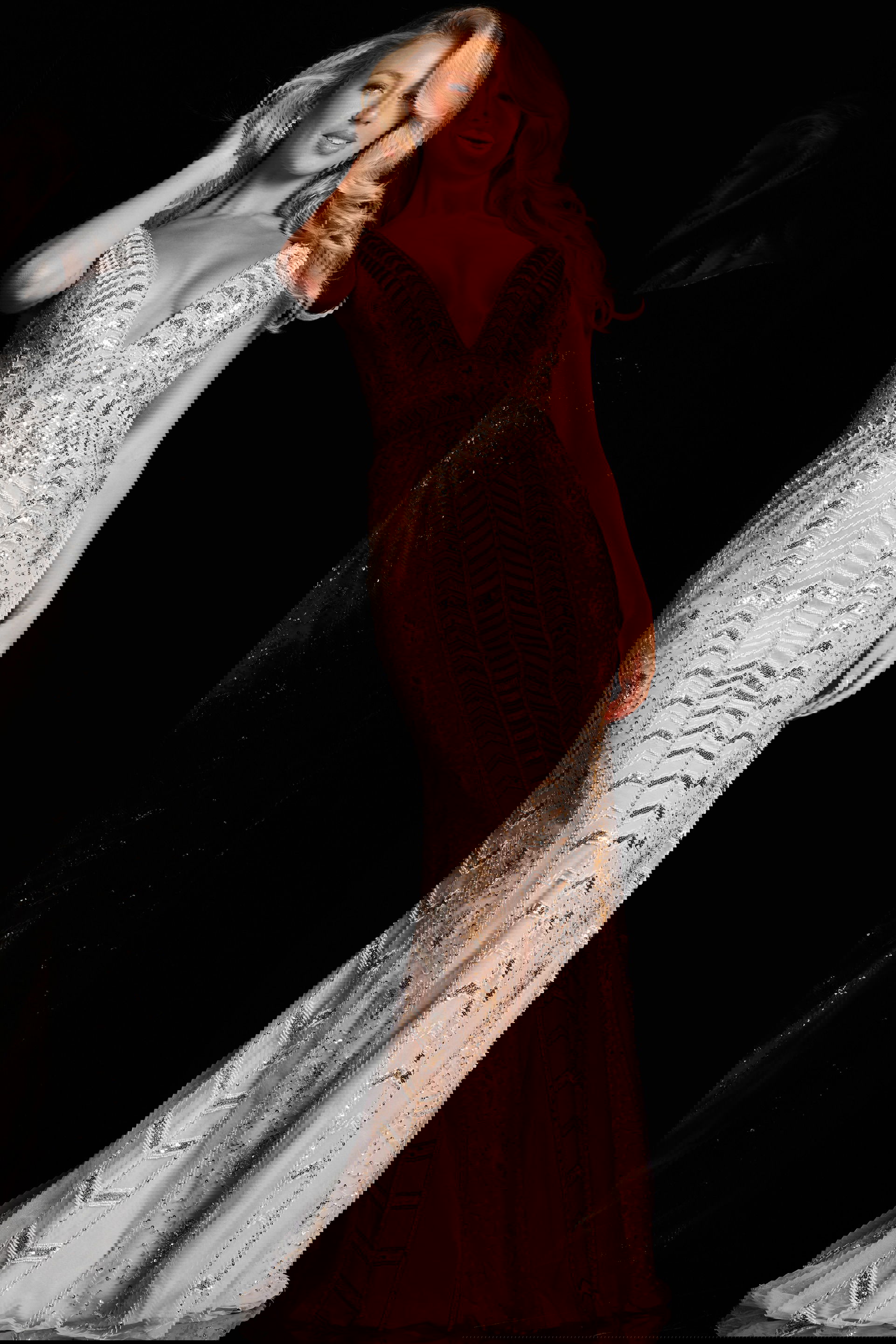 37577_3.jpg Model wearing Jovani 37577 ivory gown with deep V-neck and intricate embellishments, front view.