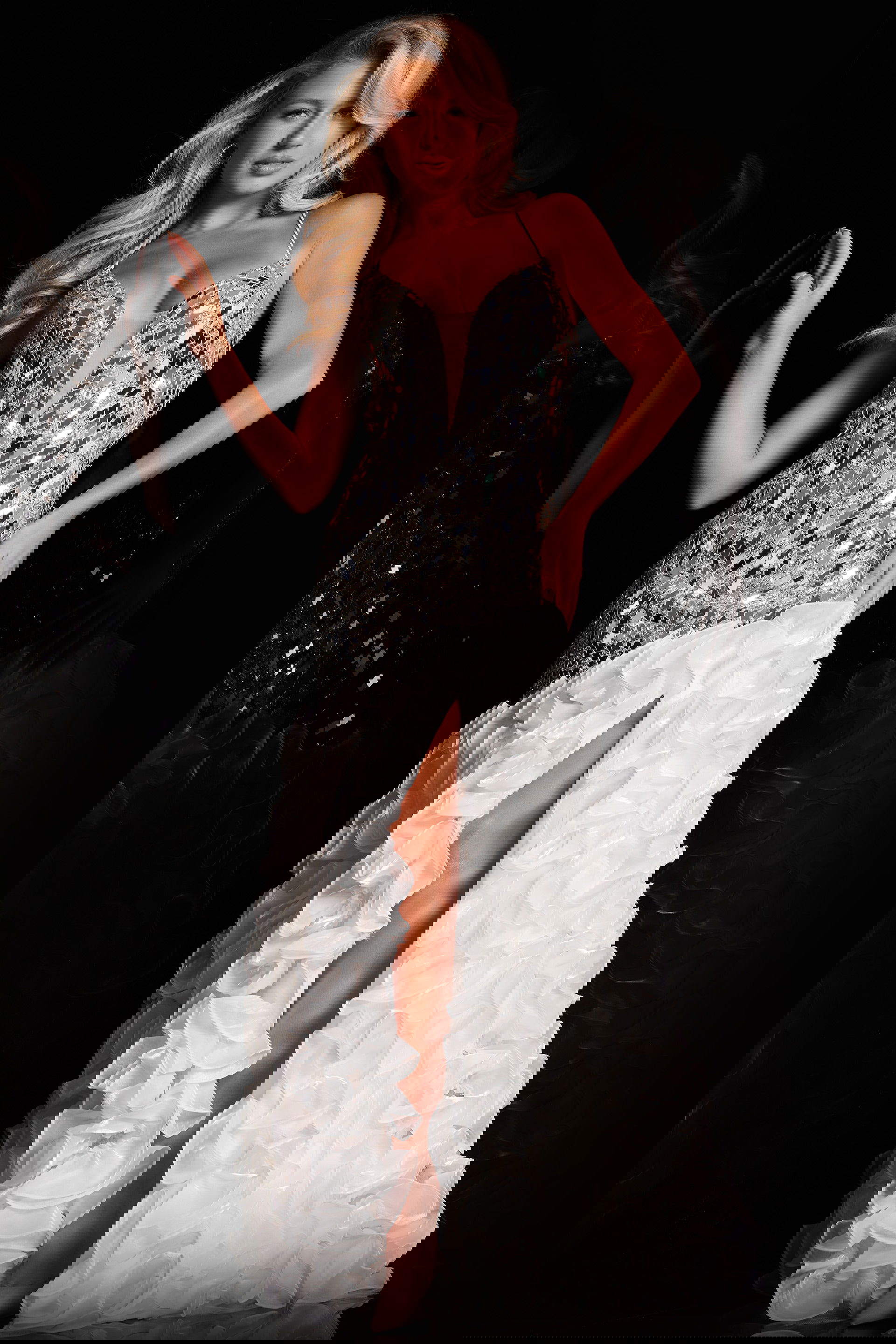 37588_1.jpg Model wearing Jovani 37588 gown with mirror embellishments and high slit front view.