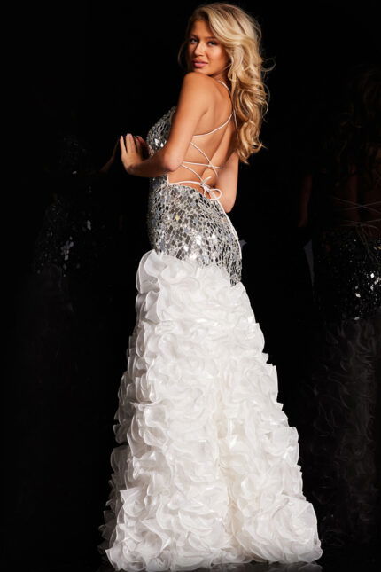 Back view of model in Jovani 37588 featuring lace-up detail and ruffled skirt.