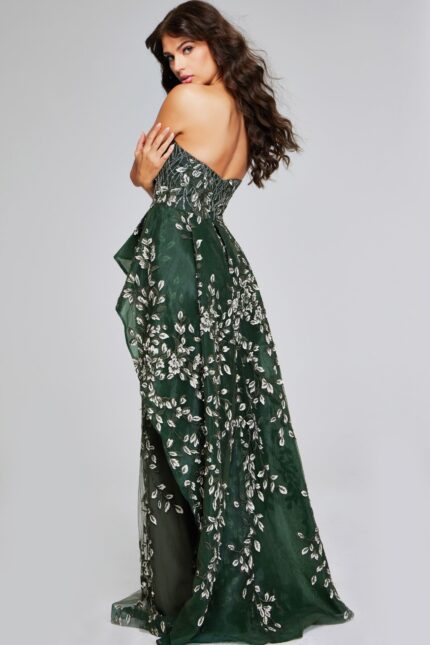 Model wearing Jovani 37599 dark green dress, back view showing the train and design.