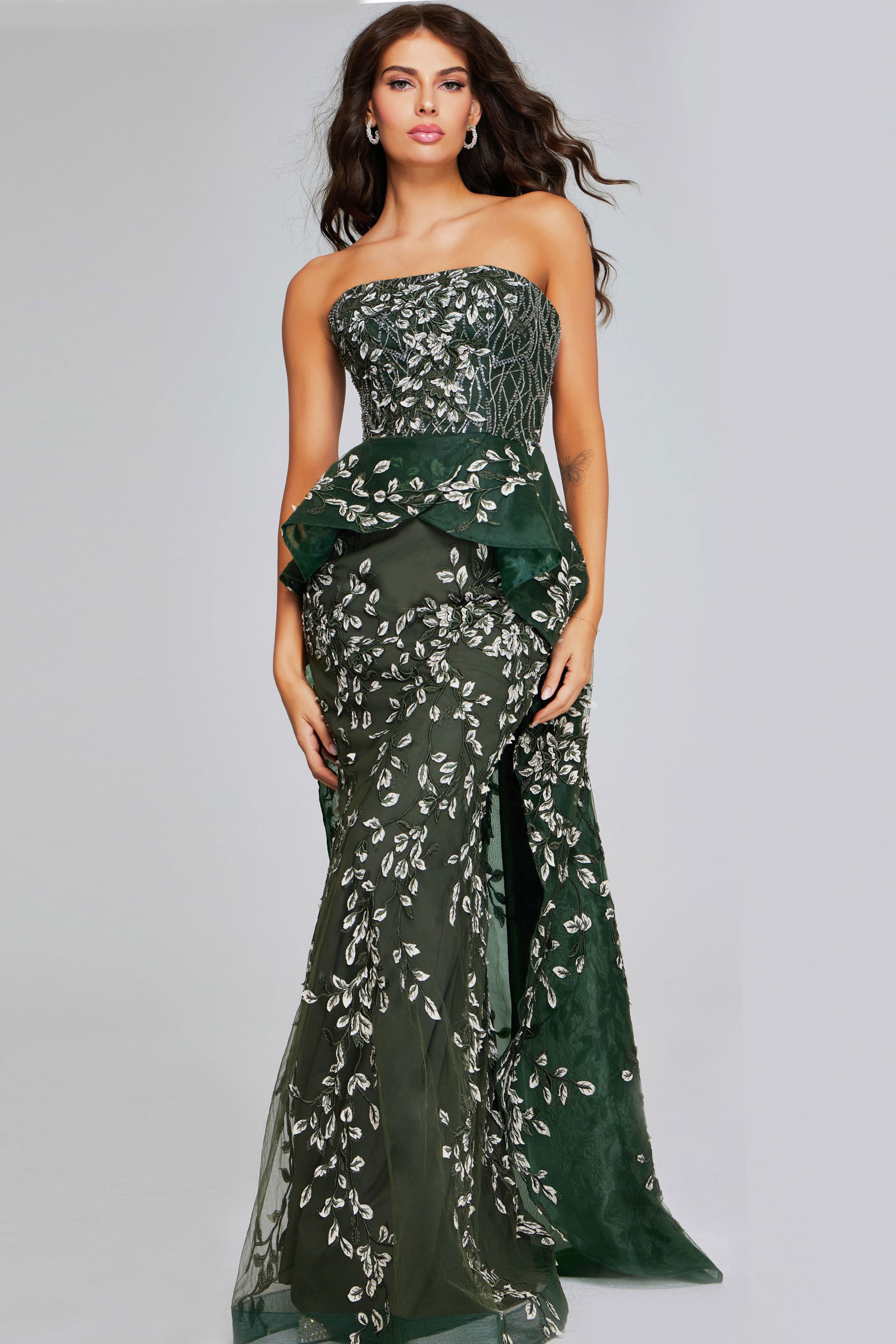 37599-DARKGREEN-208.jpg Model wearing Jovani 37599 dark green floor-length dress with strapless neckline and leaf patterns, front view.