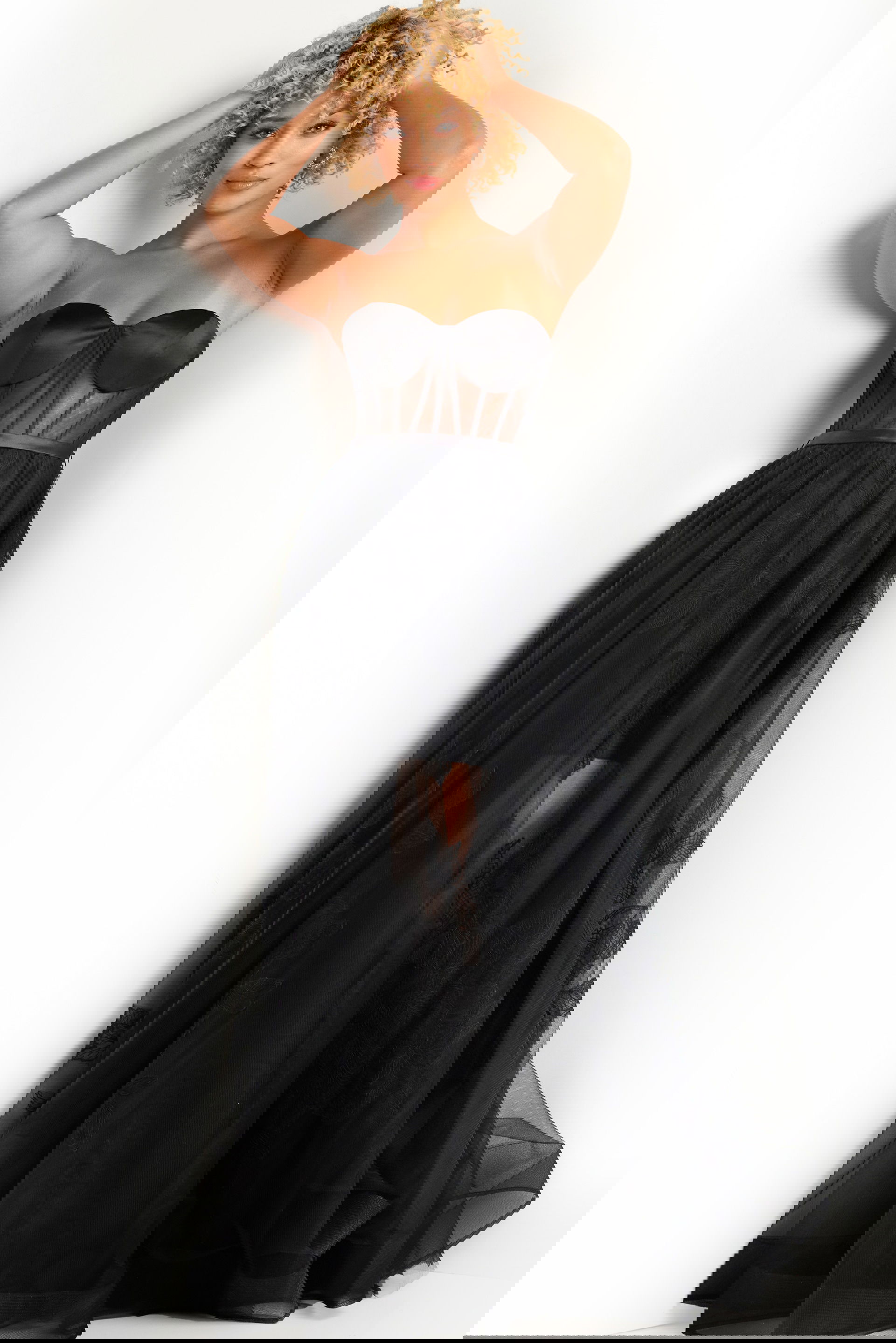 37646_3.jpg Model wearing Jovani 37646 black dress with illusion bodice and A-line silhouette.