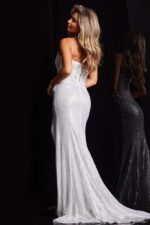 Back view of model in Jovani 37649 white gown with lace detail.