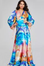 Back view of model wearing Jovani 37669 with dramatic bishop sleeves and vibrant print.