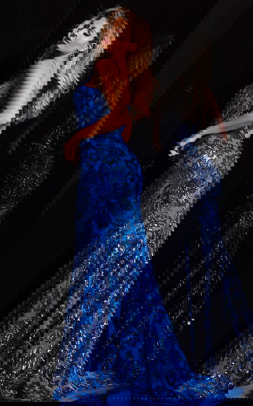 Model wearing Jovani 37687 blue mermaid dress, back view highlighting the silhouette.