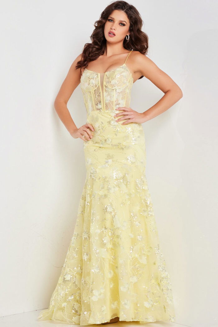 Model wearing Jovani 38004 yellow dress with floral detailing, front view.