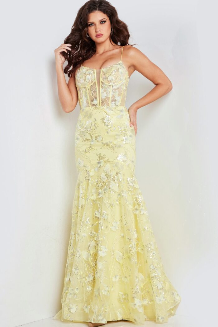 Model in Jovani 38004 yellow dress, highlighting exquisite floral embellishments.