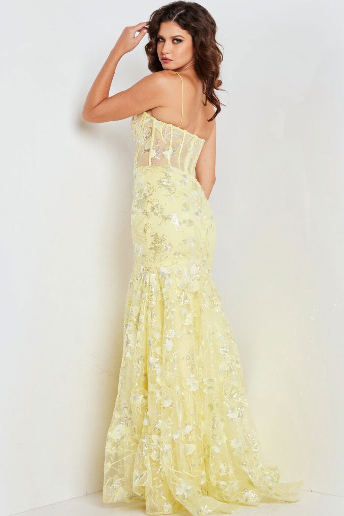 Back view of model wearing Jovani 38004 yellow dress with floral details.
