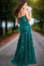 Back view of model in Jovani 38004 dark green dress showcasing elegant flare.