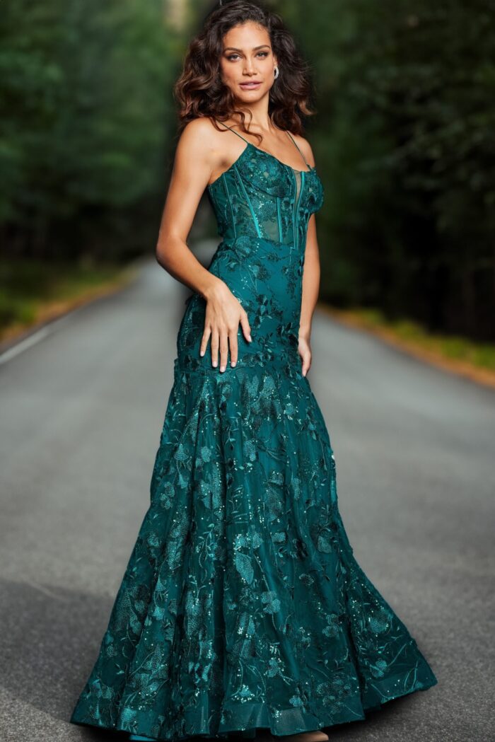 Front view of model wearing Jovani 38004 dark green dress with delicate floral patterns.