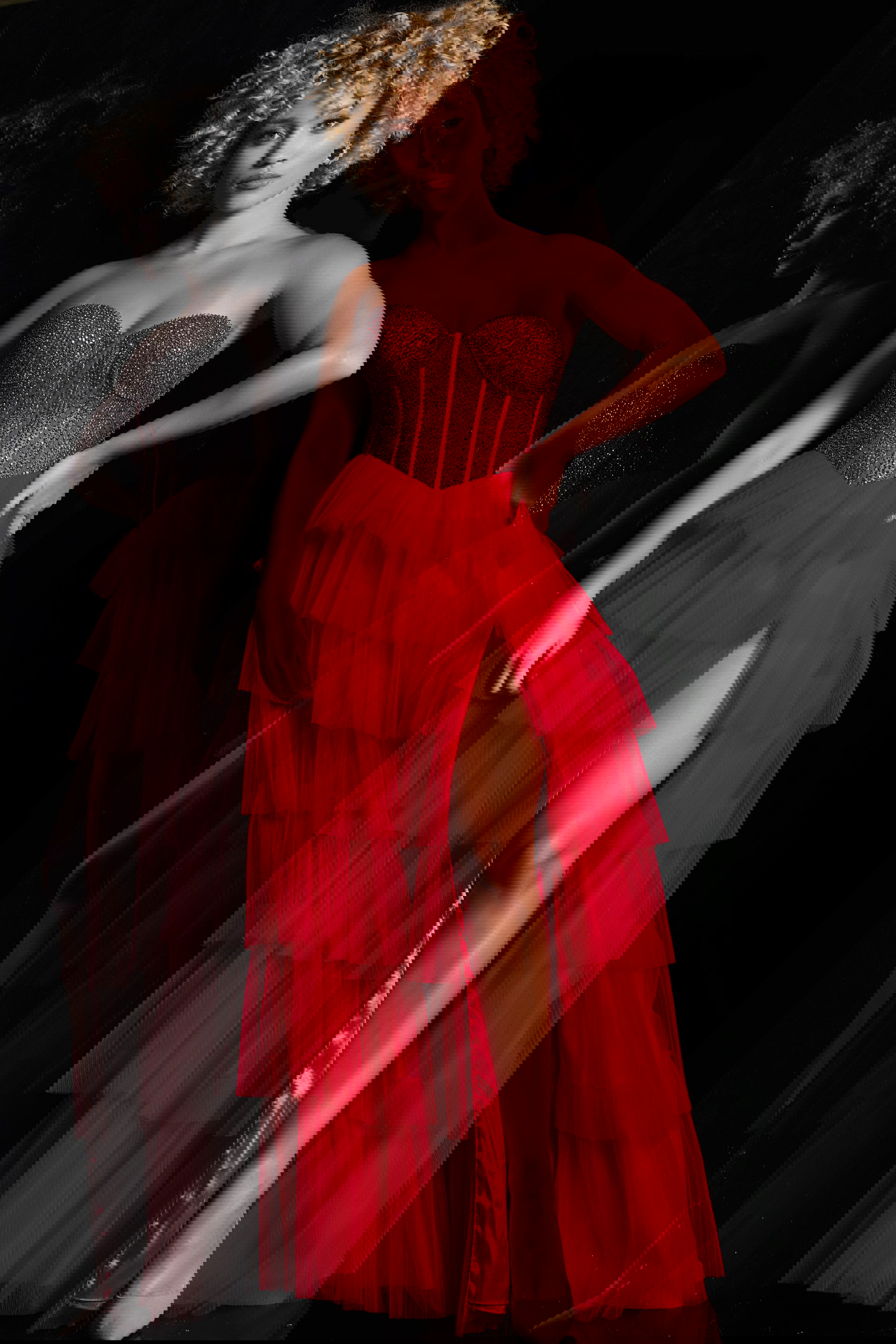 38090_red.jpg model wearing Jovani 38090 red dress with sweetheart neckline and tiered skirt