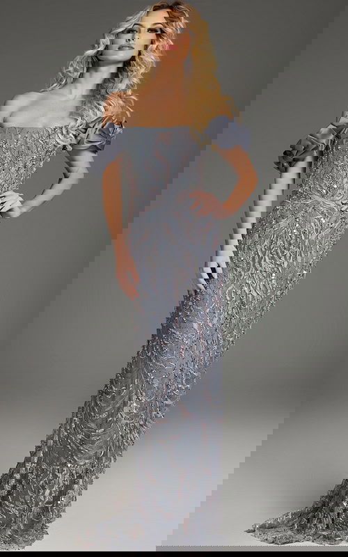 model wearing Jovani 38111 gray gown with beadwork and off-the-shoulder ruffle sleeves