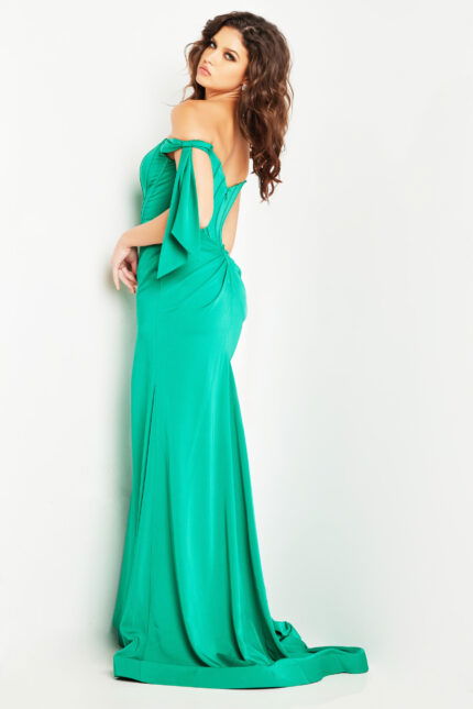Model wearing Jovani 38197 green dress with back view, highlighting the elegant flow and design.