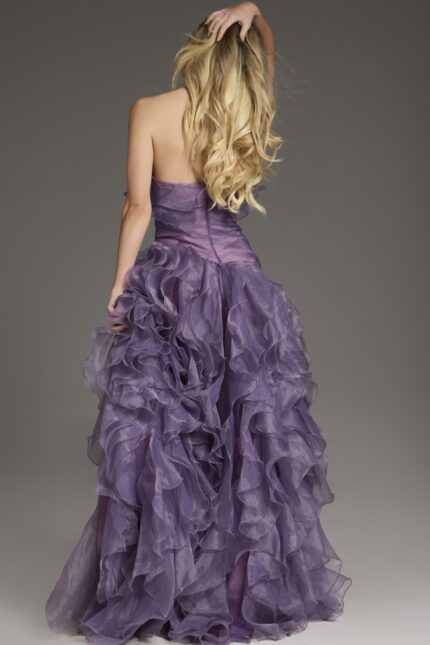 Back view of model in Jovani 38236 blush dress with ruffle details and sweetheart neckline.
