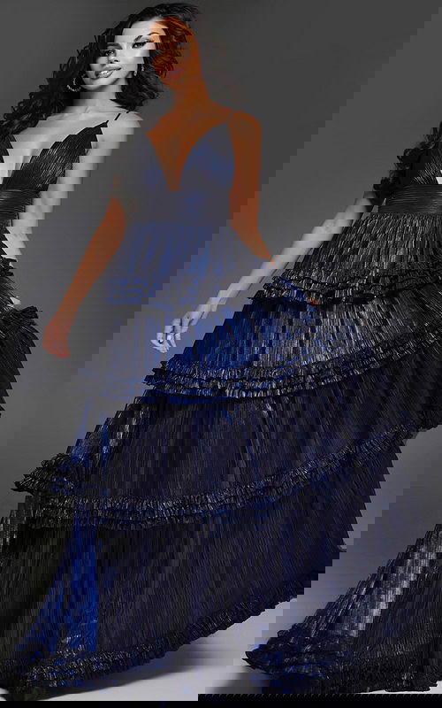 model wearing 38296 navy gown with V-neckline and layered ruffles, front view