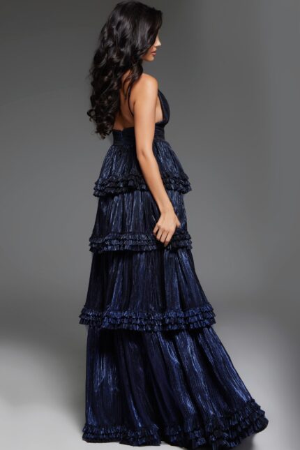 model wearing 38296 navy gown, back view showing layered ruffles