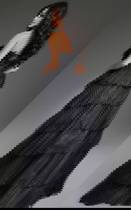 Back view of Jovani 38301 black gown showcasing tiered design.