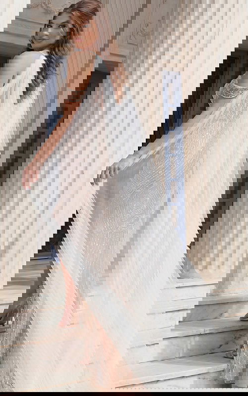 Beaded Illusion Gown With Open Back And Flowing Tulle Cape